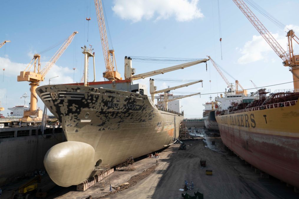 Asyad Drydock quay with heavy-lift cranes and vessels at Duqm.